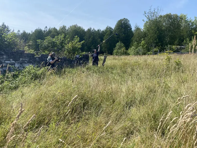 The Bruce Peninsula crew filming in a field